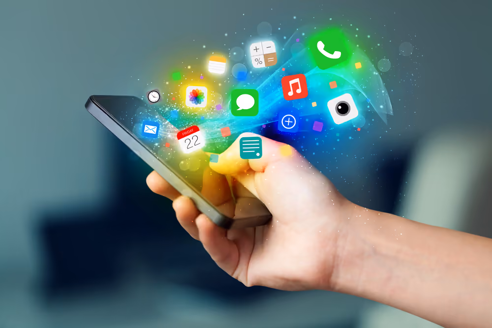 Hand holding smartphone with colorful app icons concept